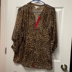 Animal print sheer tunic with red trim